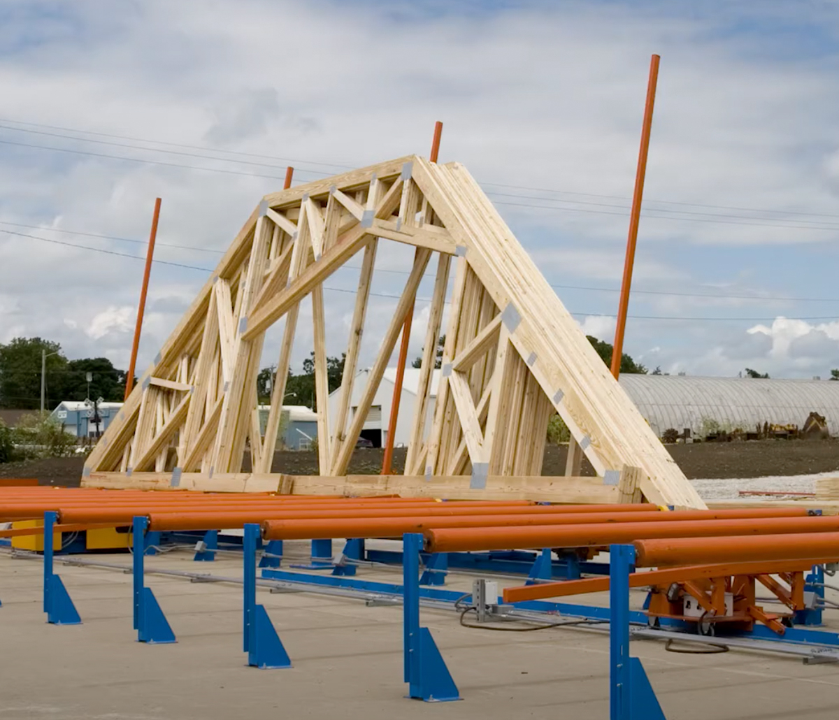 MiTek Peak Up Stacker Automated Solutions - Peak trusses being stacked